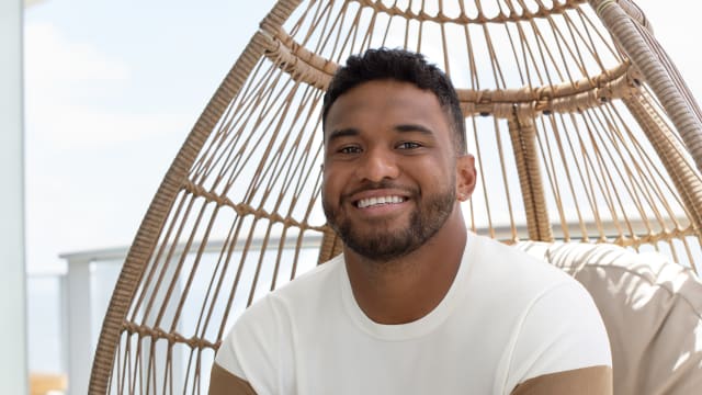 Tua Tagovailoa models brown and white Perry Ellis clothing.